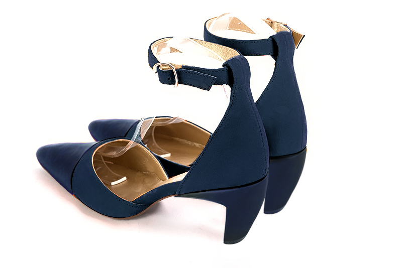 Navy blue open side shoes with a strap around the ankle. Tapered toe. Medium comma heels. Model Amazone Milan 75